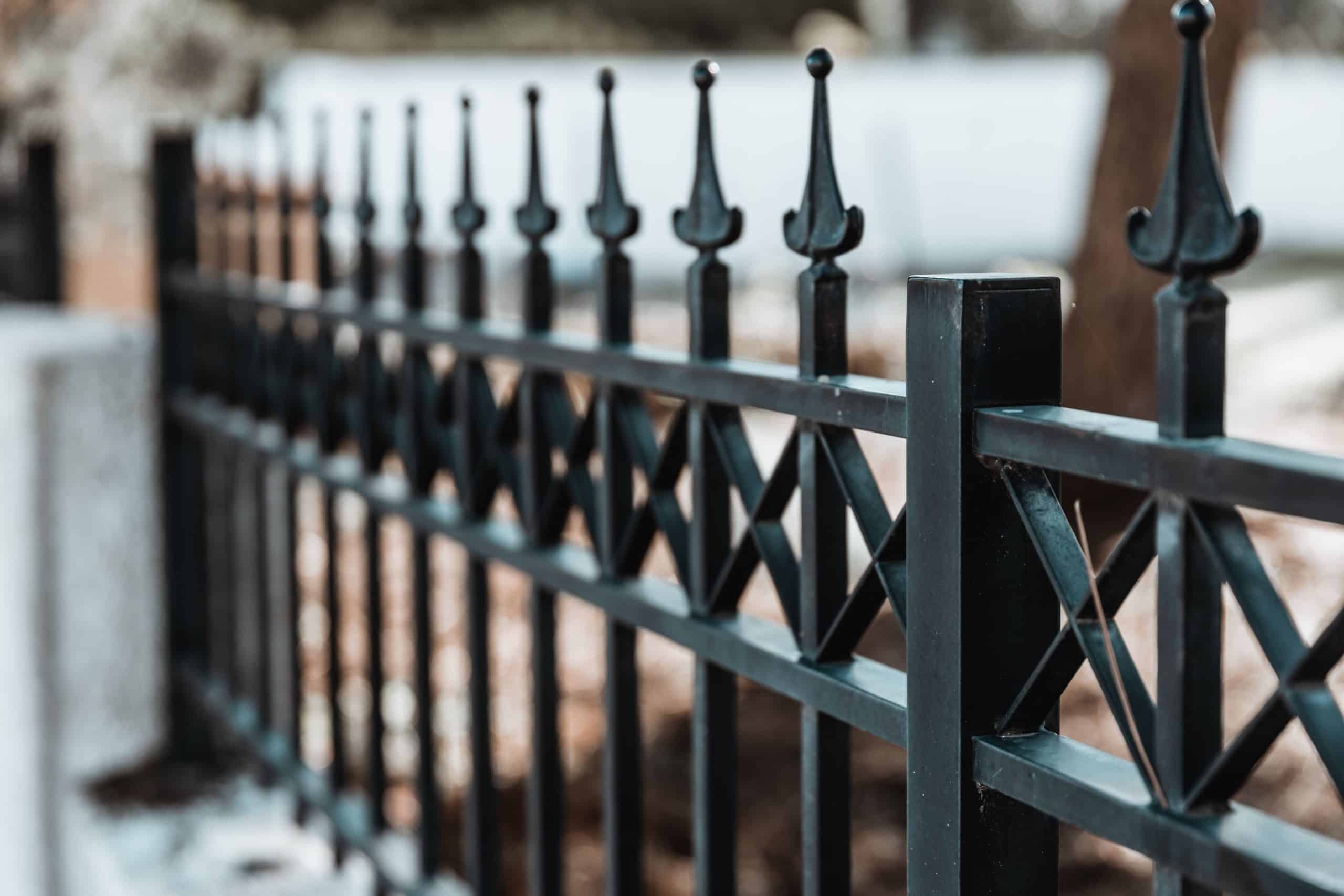 A closeup shot of an iron fence