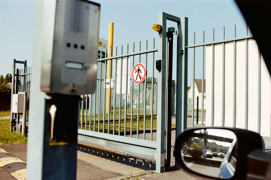 Content Image 2 : Commercial property with a fenced perimeter and driveway gate