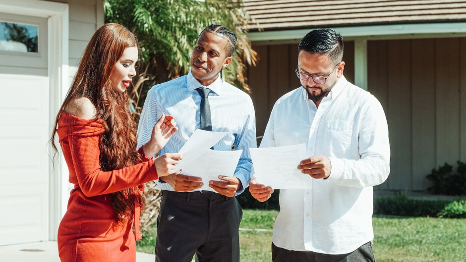 Homeowner reviewing fence paperwork with installer in New Orleans