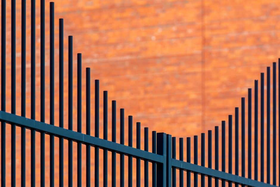 Aluminum fence line bordering a New Orleans office park