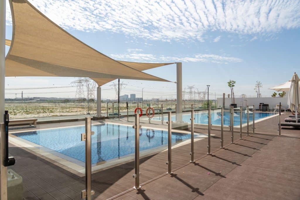 White aluminum fence surrounding a New Orleans pool area